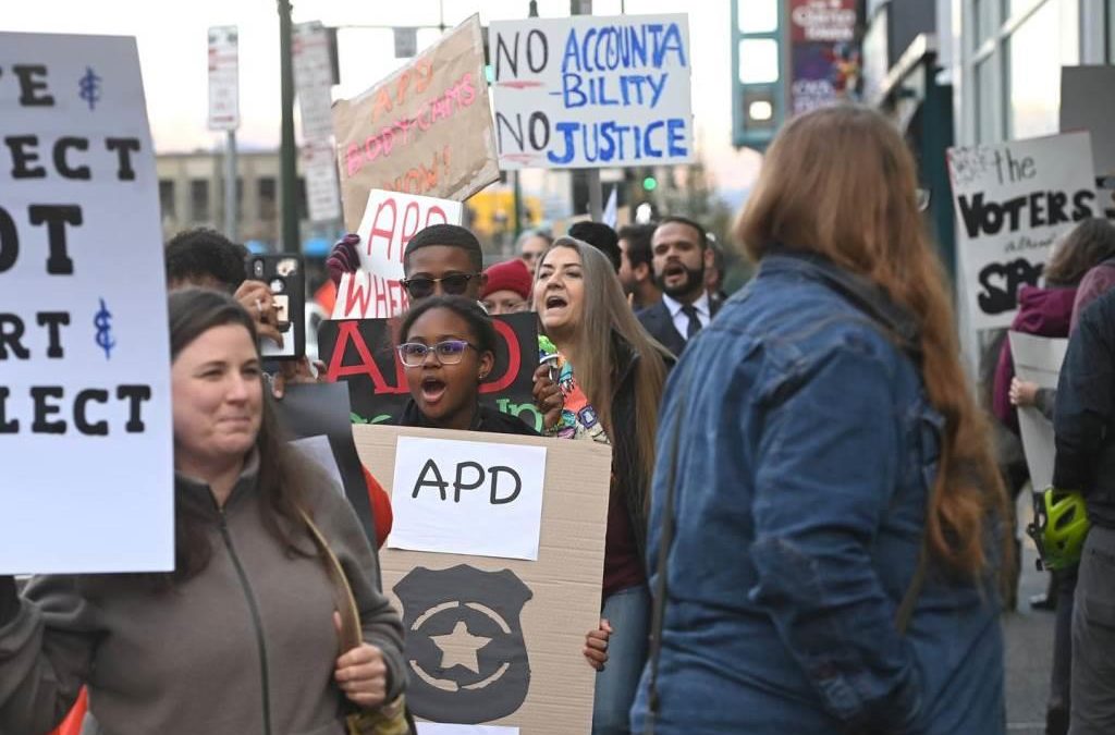 Protesters rally outside Anchorage police headquarters to decry body camera delays