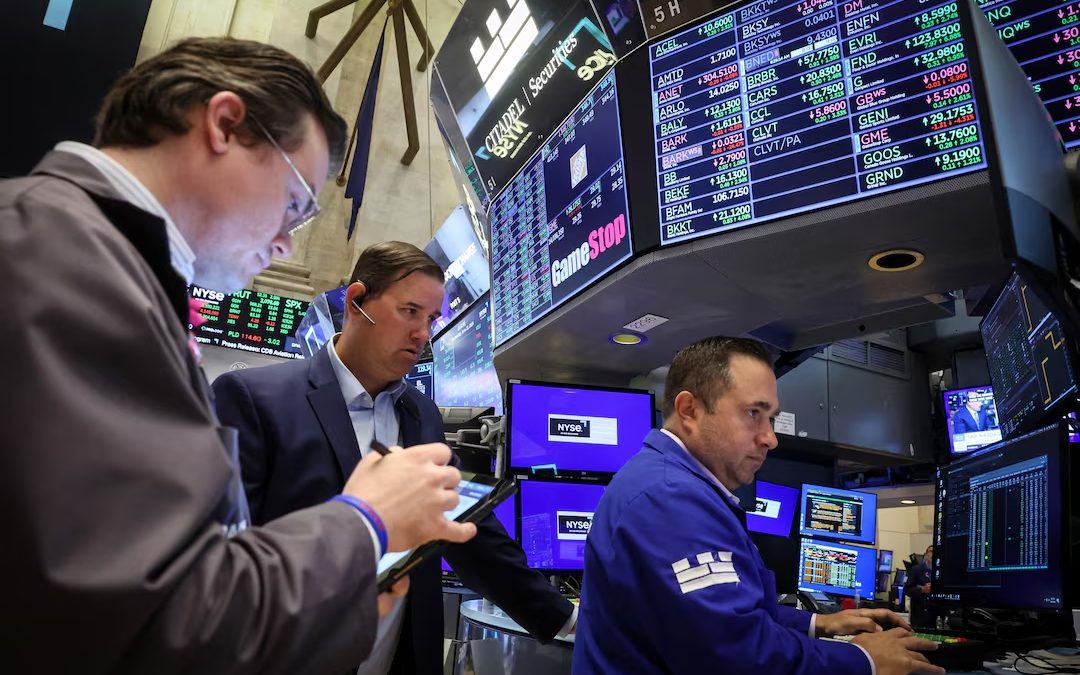 Wall Street notches record closing highs on cooler inflation data